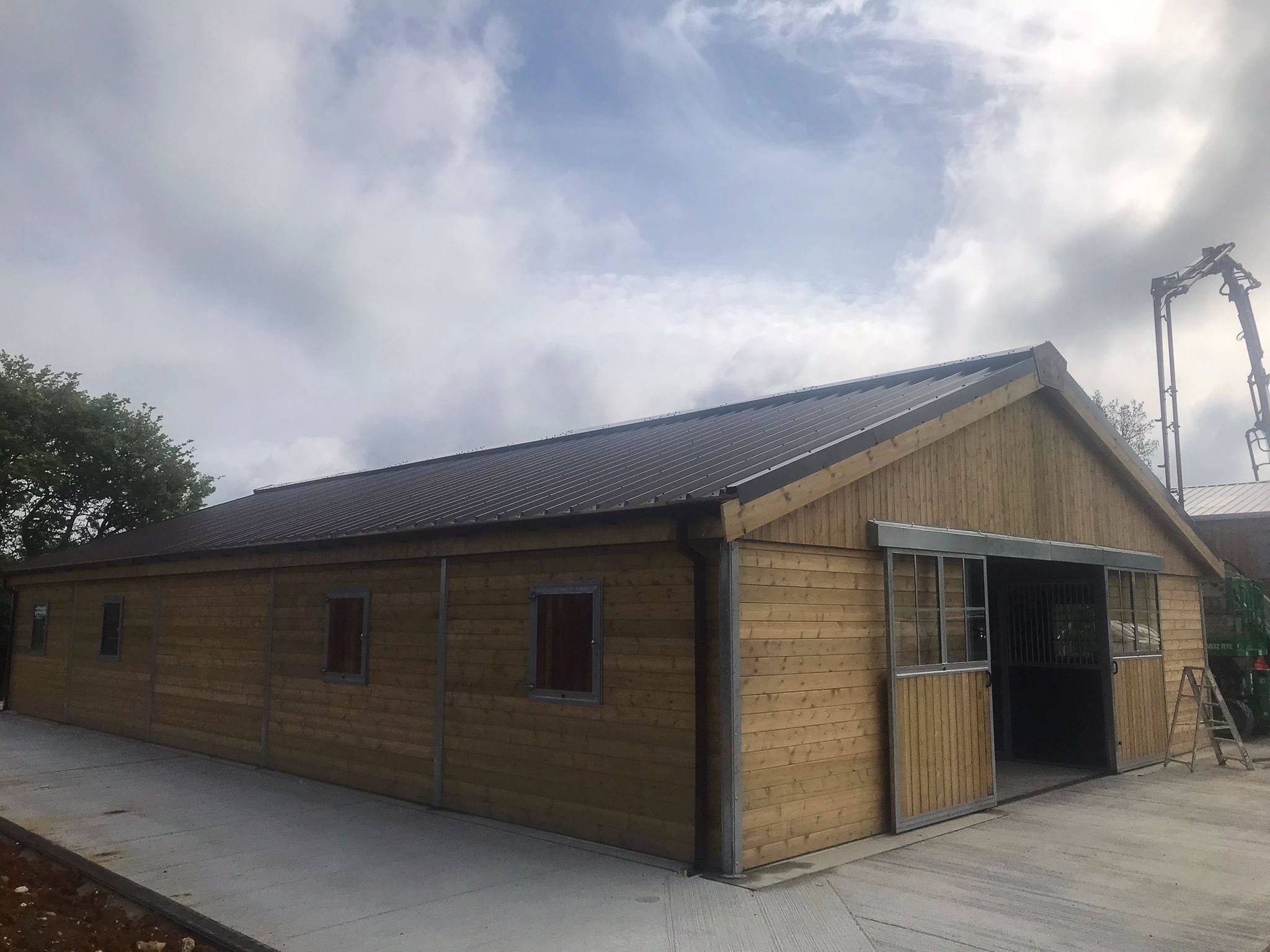 Close-up of the exterior of a Barn, emphasizing the insulated cladding and polished construction finish